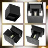 A collage of four images showing different angles of a black cube-shaped outdoor wall light with an LED light. Voir les images du produit