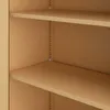 Close-up of two shelves of a beige metal cabinet. Anteprima dell’immagine prodotto