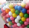 A close-up view of a gumball machine filled with colorful gumballs. Anteprima dell’immagine prodotto