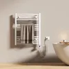 A bathroom setting with a towel warmer, bathtub, and candle. Produktbild-Vorschau