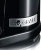 Close-up of a black coffee grinder's control panel with a silver trim and the brand logo. Podgląd zdjęcia produktu