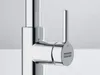 A close-up, studio shot of a chrome faucet handle. Podgląd zdjęcia produktu