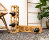 A natural light setting with a bamboo ladder and a plant in the background, showcasing the wooden wine racks. Produktbild-Vorschau