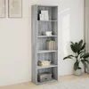 A tall, narrow bookshelf filled with books and a box, placed against a white wall with artwork on the left and a plant on the right. Voir les images du produit