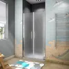 A modern bathroom with a frosted glass shower enclosure, a towel rack, and decorative wall art. Produktbild-Vorschau