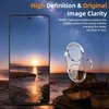 A smartphone screen displaying a sunset over a rocky shore, with a camera lens protector placed in the foreground. Produktbild-Vorschau