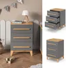 A collage of a gray chest of drawers with wooden accents, shown in a nursery setting and as a standalone product. Náhled obrázku produktu