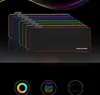 A stack of RGB gaming mousepads with different colored LED edges, displayed on a black reflective surface with a colorful wavy light effect in the background. Below the mousepads are three circular icons, one with a color cycle, one with a fingerprint, and Produktbild-Vorschau