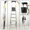 Collage of images showing a foldable aluminum ladder in different states and uses, including a person using it and a bucket attached. Náhled obrázku produktu