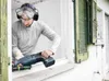 A man is using a reciprocating saw to cut through a window frame. Voir les images du produit