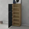A wooden cabinet with black doors, open to reveal shelves, stands in a room with a gray wall and tiled floor. Two pairs of shoes are on the floor near the cabinet. Voir les images du produit