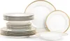 A set of white porcelain dinnerware with gold trim is neatly stacked and arranged against a white background. Náhled obrázku produktu