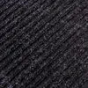 A close-up view of a dark-colored mat with a ribbed texture. Anteprima dell’immagine prodotto