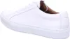 A side view of a white leather sneaker. Produktbild-Vorschau