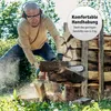 A man is using a chainsaw to cut wood in an outdoor setting. Produktbild-Vorschau