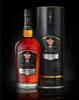 A bottle of Havana Club Añejo 15 Años Gran Reserva rum and its presentation box against a black background. Produktbild-Vorschau