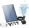 A solar panel fountain pump kit with various nozzle attachments and a coiled hose, set against a white background with a water spray effect. Produktbild-Vorschau