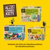 A collage of three different craft kits for children, presented on a bright yellow background. The kits are labeled 'Schnitzen' (carving), 'Meine Große Bastelbox' (My Big Craft Box), and 'Lichter Kette' (Light Chain). Two cartoon-like black characters are  Anteprima dell’immagine prodotto