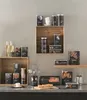 A collection of kitchen storage containers and accessories arranged on shelves and a countertop. Produktbild-Vorschau