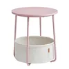 A round pink side table with a white fabric storage basket underneath, shown on a white background. Náhled obrázku produktu