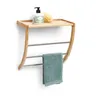A bamboo and metal towel rack with a towel hanging on it, mounted on a white wall. Náhled obrázku produktu