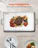 A large stainless steel griddle with food on it, along with plates and cutlery. Produktbild-Vorschau