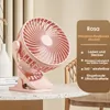 A pink clip-on fan is displayed on a speckled countertop, with text overlay describing its features. Produktbild-Vorschau