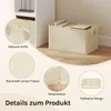 A cream-colored storage box filled with books, placed on a wooden floor next to a white shelf unit. The image is overlaid with circular close-ups highlighting product features. Produktbild-Vorschau