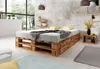 A bedroom scene featuring a pallet bed with storage drawers, bedside table, and decor. Produktbild-Vorschau