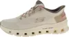 A side view of a single Skechers sneaker. Voir les images du produit
