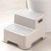 A two-step stool for children, likely for use in a bathroom. Produktbild-Vorschau