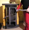 A person is vacuuming the inside of a pellet stove. Náhled obrázku produktu