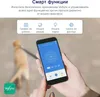 A person is holding a smartphone displaying an air purifier app, with a blurred background of a cat on a leash. Náhľad obrázku produktu