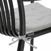 Close-up of a chair cushion tie and a tag. Produktbild-Vorschau
