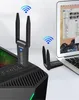 A computer tower and laptop with WiFi adapters, illustrating network connectivity. Produktbild-Vorschau