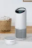 An air purifier and its sensor are placed on a rug next to a laundry basket. Produktbild-Vorschau