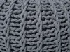 A close-up view of a gray knitted pouf. Náhled obrázku produktu