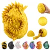 A collage of dragon egg toys in various colors, with a larger yellow dragon egg in the center, and a hand holding a smaller yellow egg in the top right. Voir les images du produit