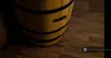 A close-up view of a wooden barrel-shaped wine rack on a wooden floor. Produktbild-Vorschau