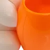 A close-up view of a white and orange object, possibly a lamp base. Produktbild-Vorschau