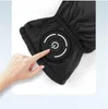 A hand is shown pressing a power button on a black glove. Anteprima dell’immagine prodotto