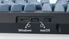 A close-up view of the side of a mechanical keyboard, showing connection ports and mode switches, with labels indicating Windows and macOS compatibility. Anteprima dell’immagine prodotto