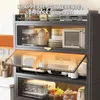 A kitchen cabinet with appliances inside, showing a flip-up door feature. Anteprima dell’immagine prodotto