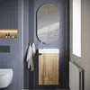 A modern bathroom vanity with a sink and cabinet, a mirror, and a toilet. Voir les images du produit