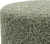 A close-up view of a green, textured pouf. Produktbild-Vorschau