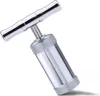 A silver metal pollen press with a T-shaped handle is shown against a white background. Produktbild-Vorschau
