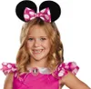 A young girl wearing a Minnie Mouse costume, including ears and a pink polka dot dress. Produktbild-Vorschau