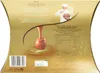 The back of a gold-colored chocolate box with nutritional information and branding. Produktbild-Vorschau