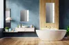 A modern bathroom with a bathtub, sink, and mirrors. Produktbild-Vorschau