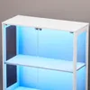 A close-up view of a white, four-tiered glass display cabinet with blue LED lighting. Náhled obrázku produktu